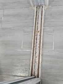 Completely rusted metal around door.