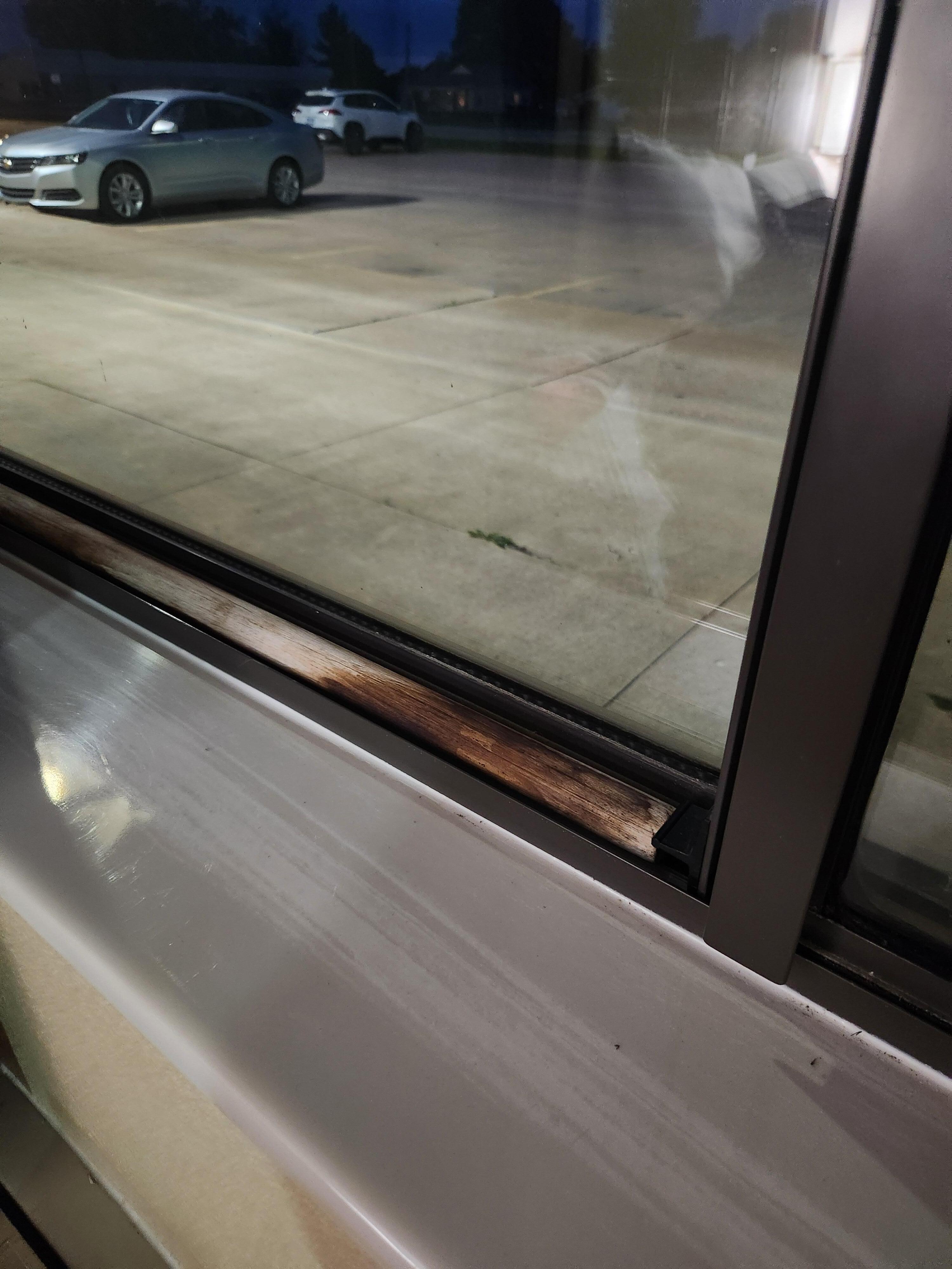 Stick keeping window from being opened from the outside. However the window still opened a few inches.