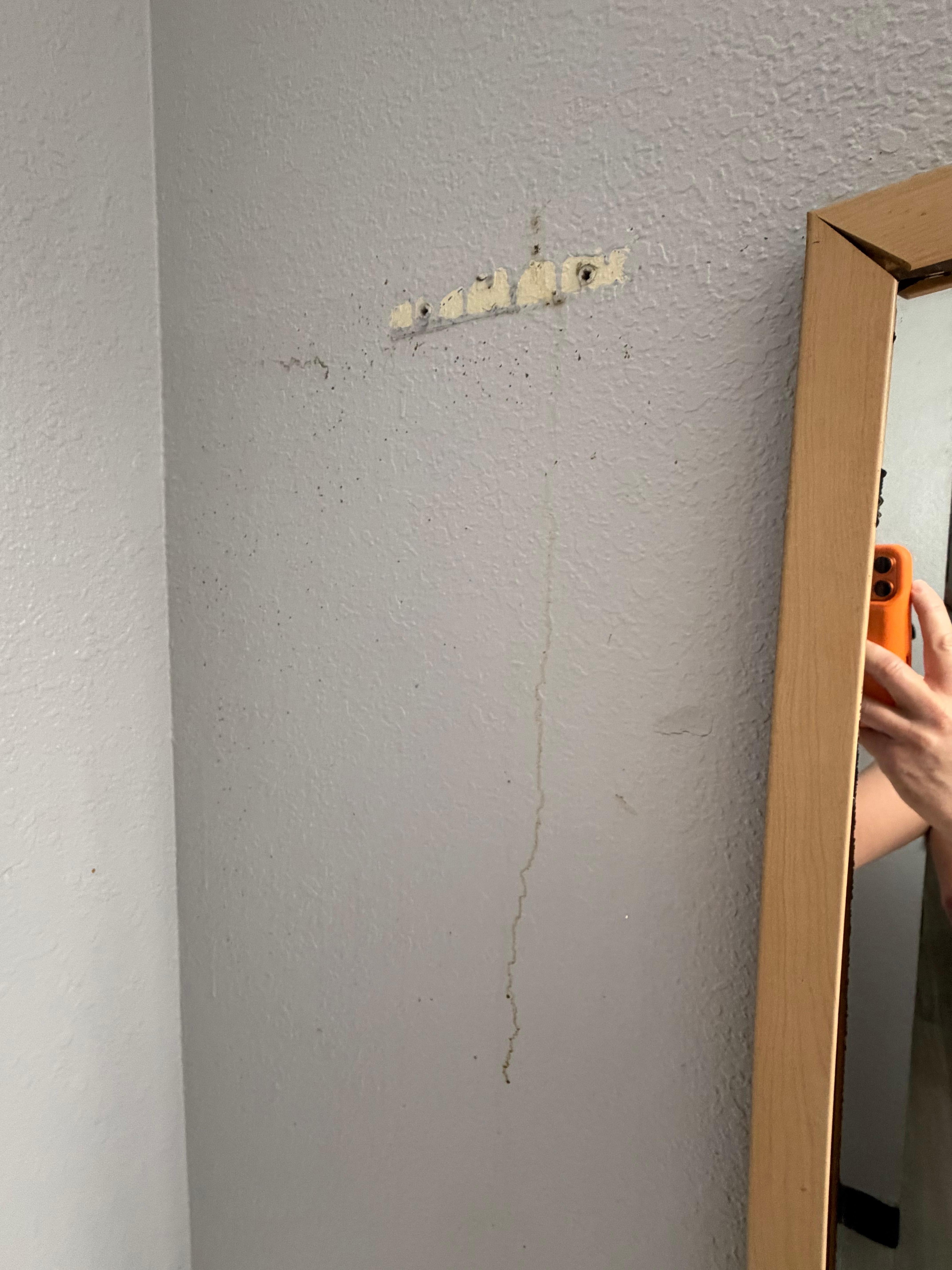 Wall with stain and missing stuff