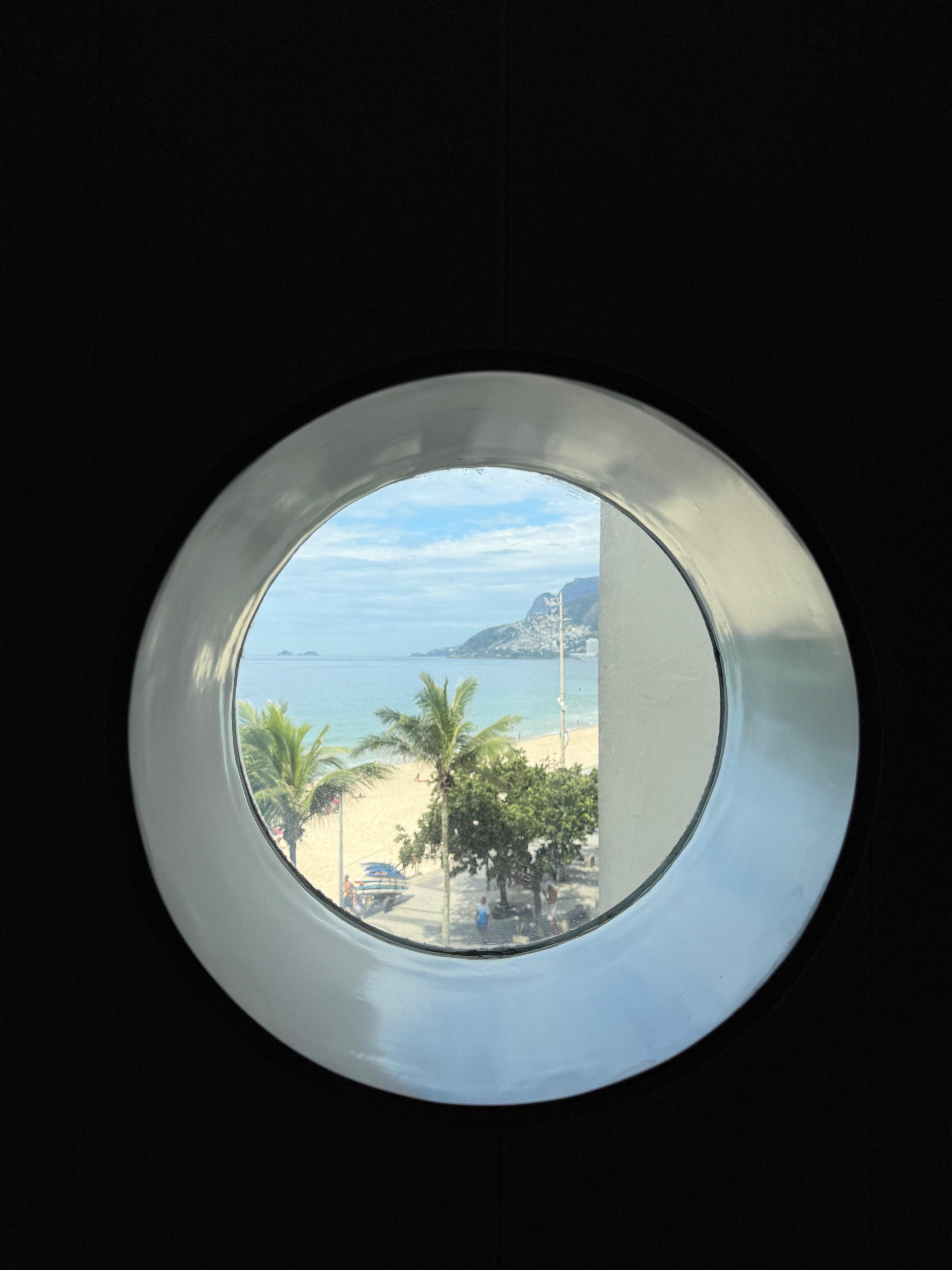 Porthole window in hotel corridor