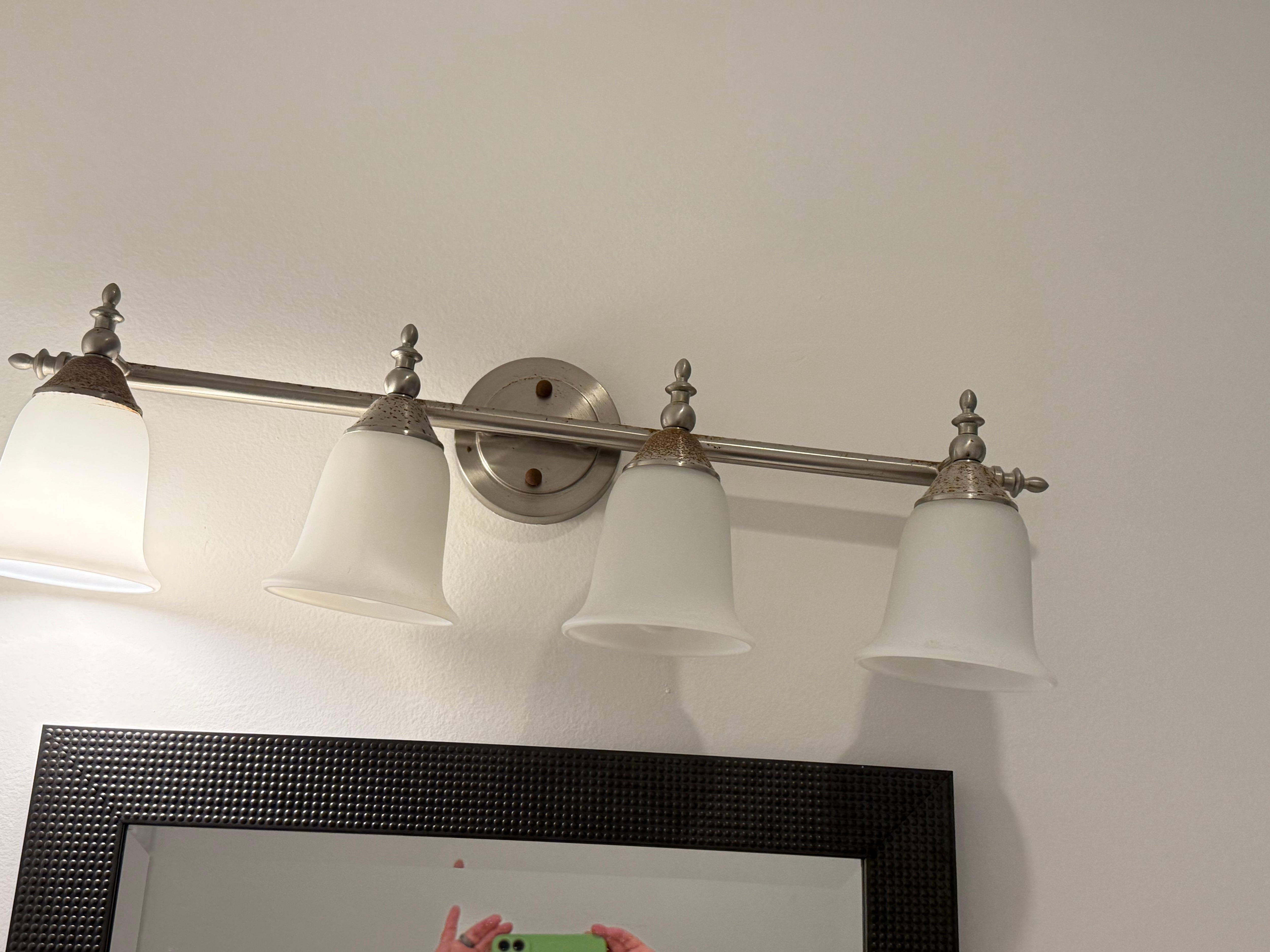 Only 1 light bulb i. working conditions in the restroom.