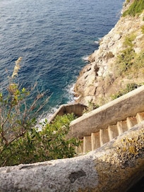 Steps to the sea! Be sure to wear sturdy shoes