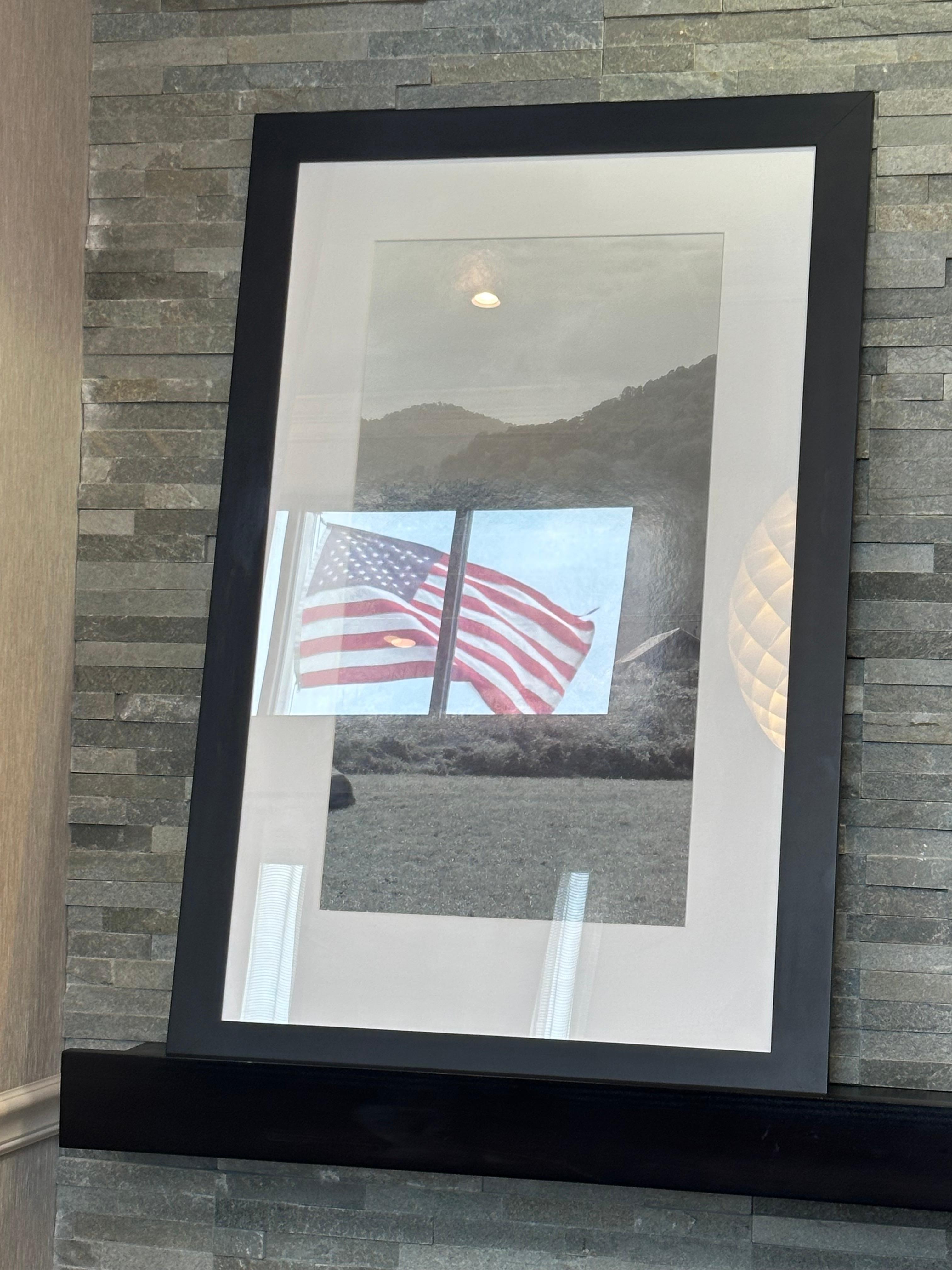 This is a photo frame in the dining area. We captured the reflection of our beautiful American flag flying freely with the wind. Incidentally, this was taken on “Flag Day” June 14th, 2025 ❤️🏳️🦅💙🇺🇸!