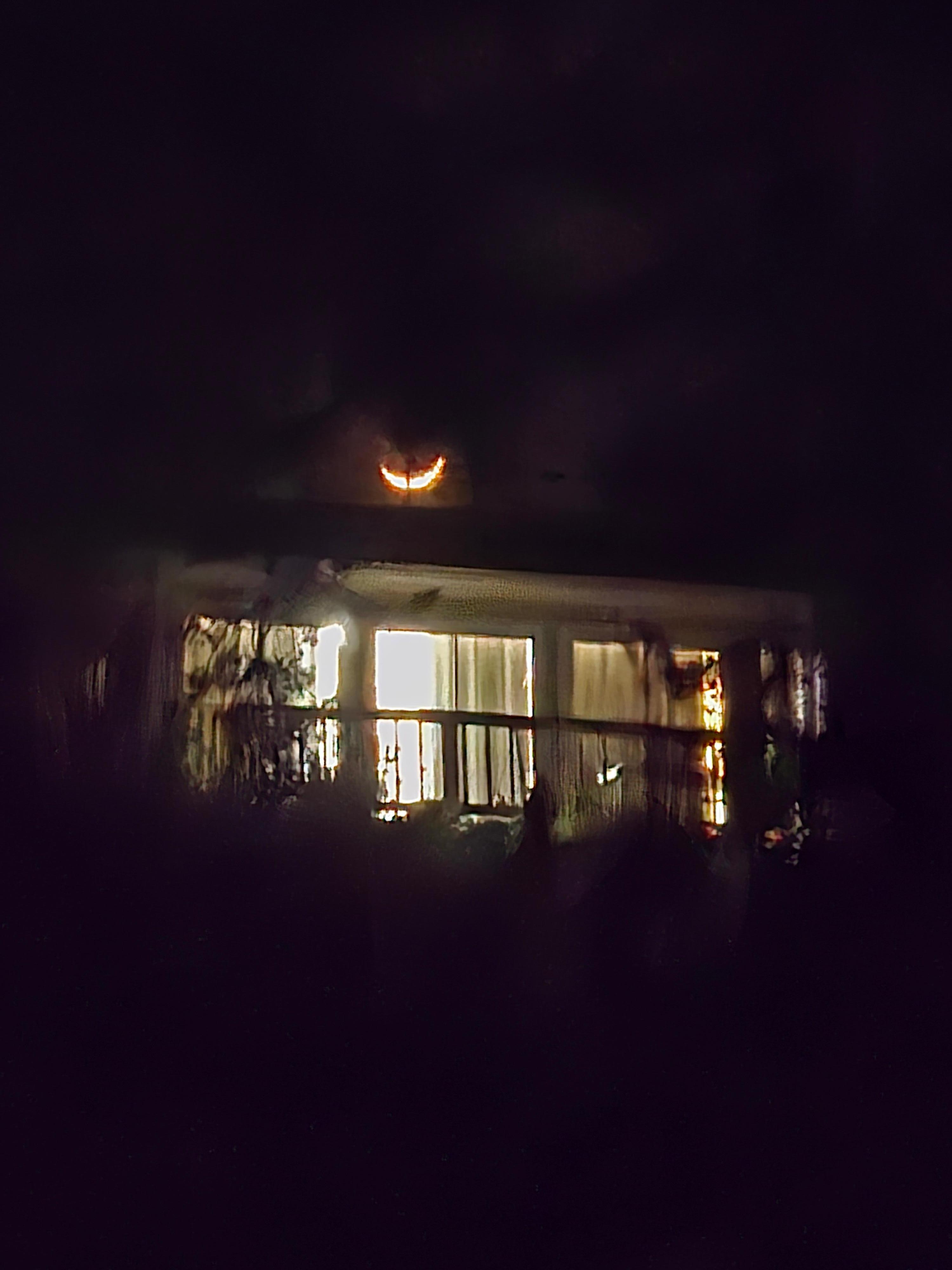 Crescent moon over the house. Sorry for the clarity, it was a pretty long shot from the dock.