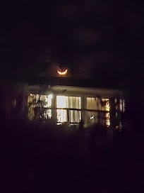 Crescent moon over the house. Sorry for the clarity, it was a pretty long shot from the dock.