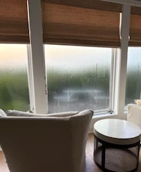 Condensation from window sill damage taking away ocean view.