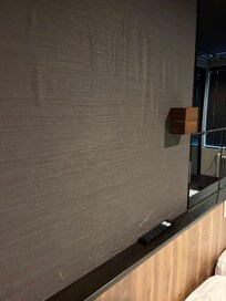 Bulgy wallpaper above the bed