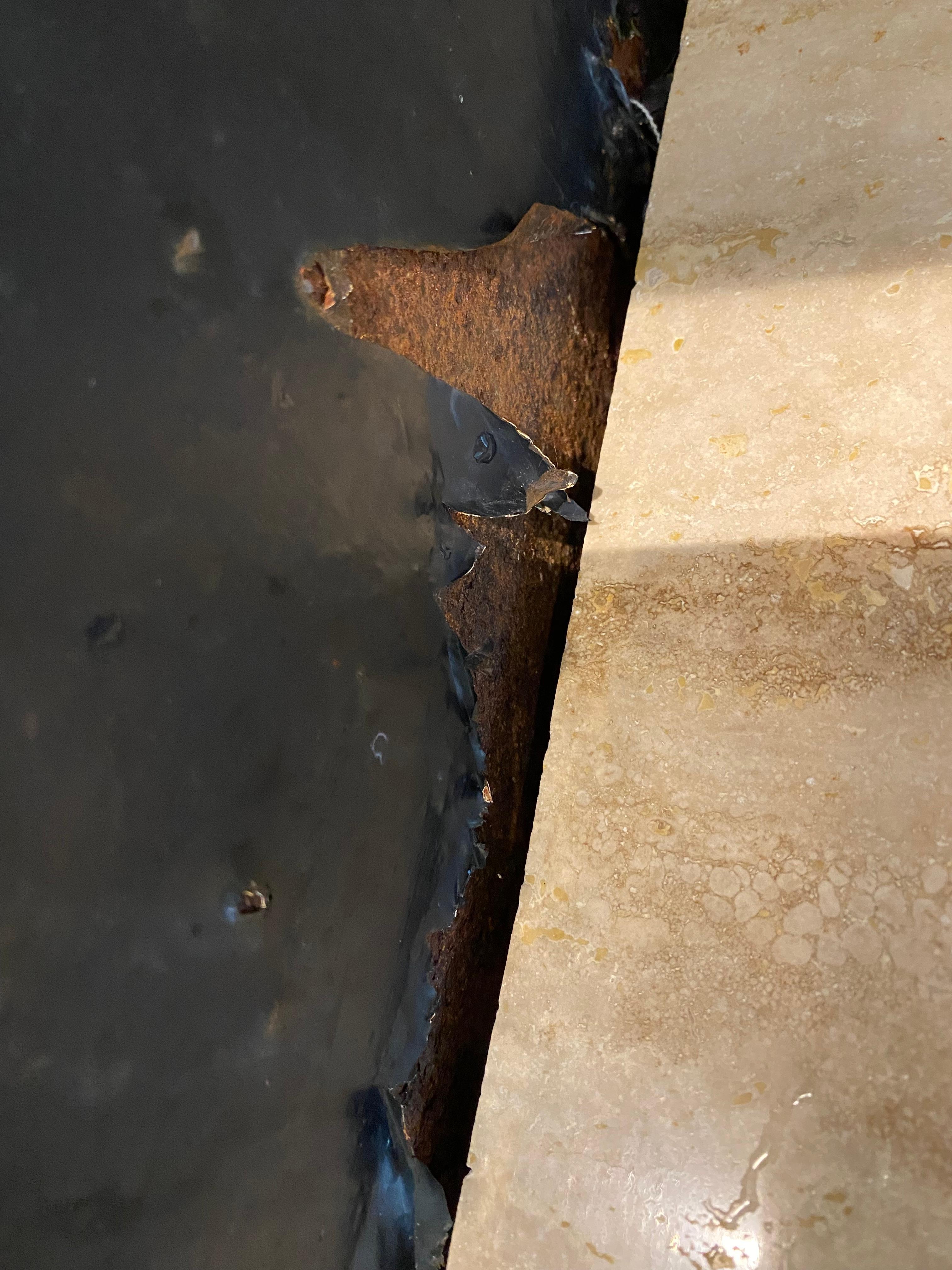 Rusted out leaky fridge.