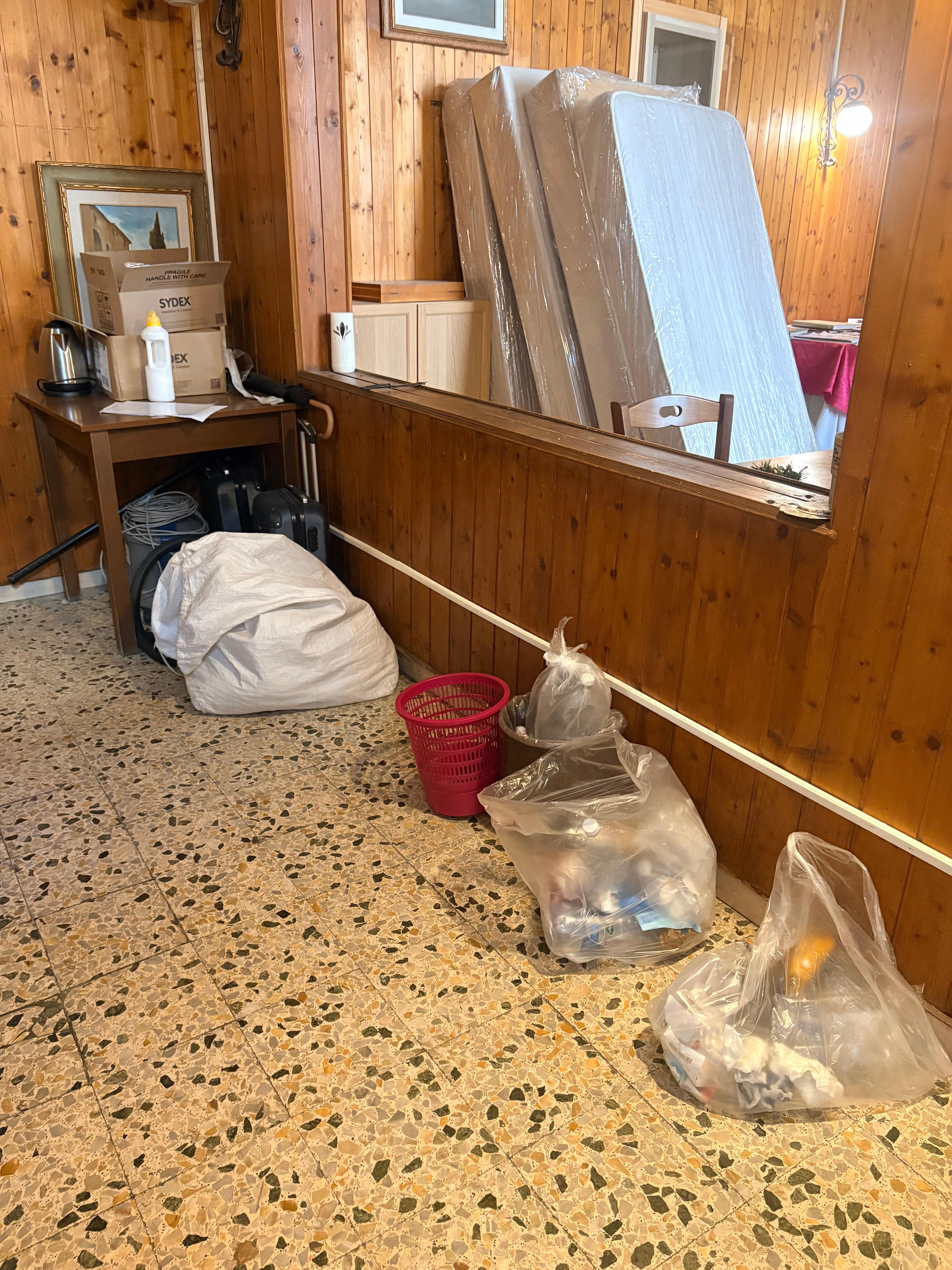 Common area full of garbage and more lika a storage!