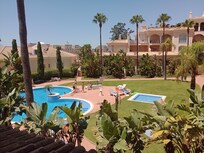 Pool with well maintained gardens