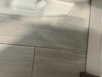 dirty floor on other side of toilet