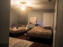 Large bedroom with two queen beds and private bathroom.