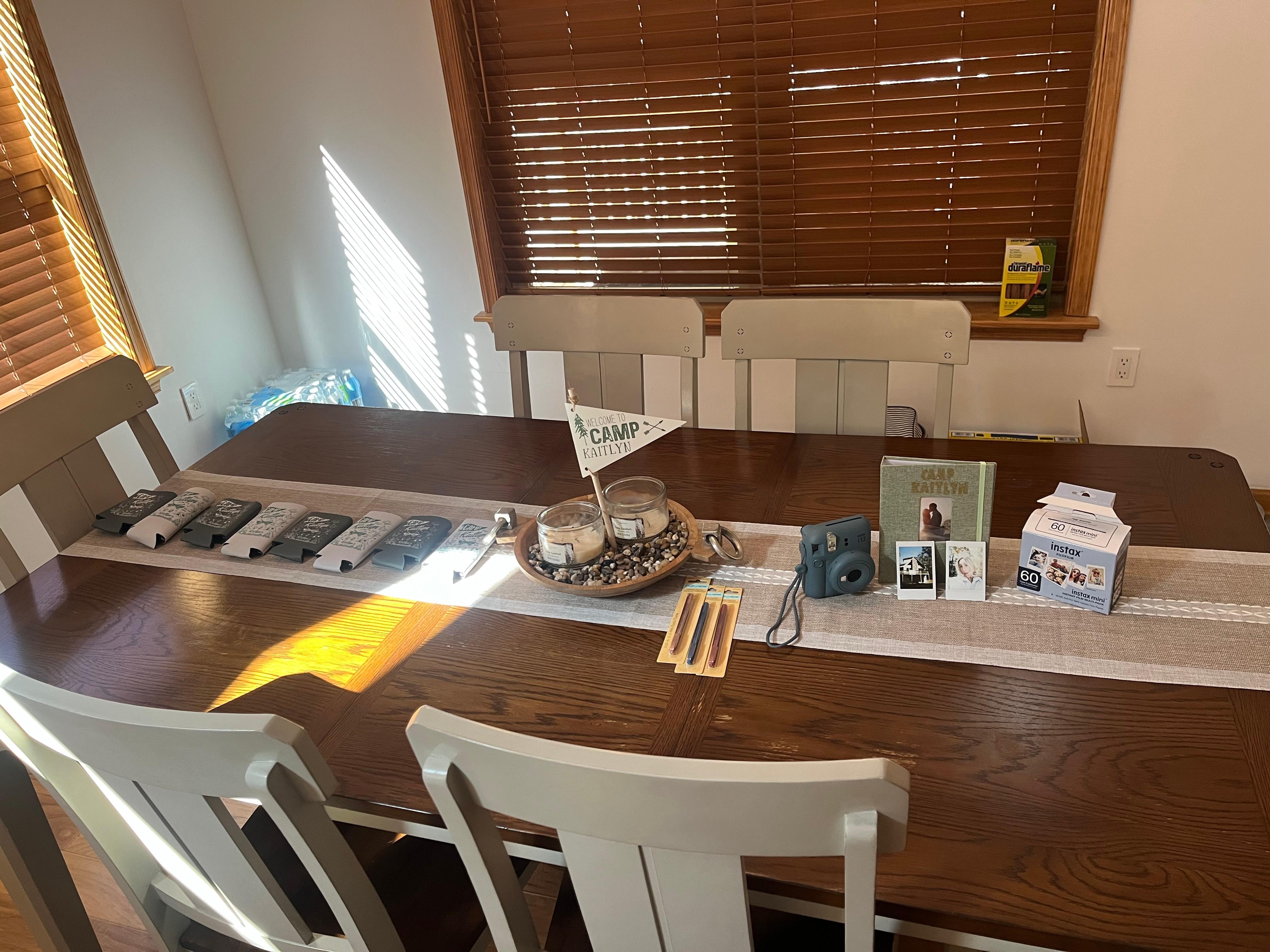 Fun little set up with our drink cozies and Polaroid camera 📸 