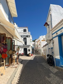 The street as you walk uphill from town and beach.