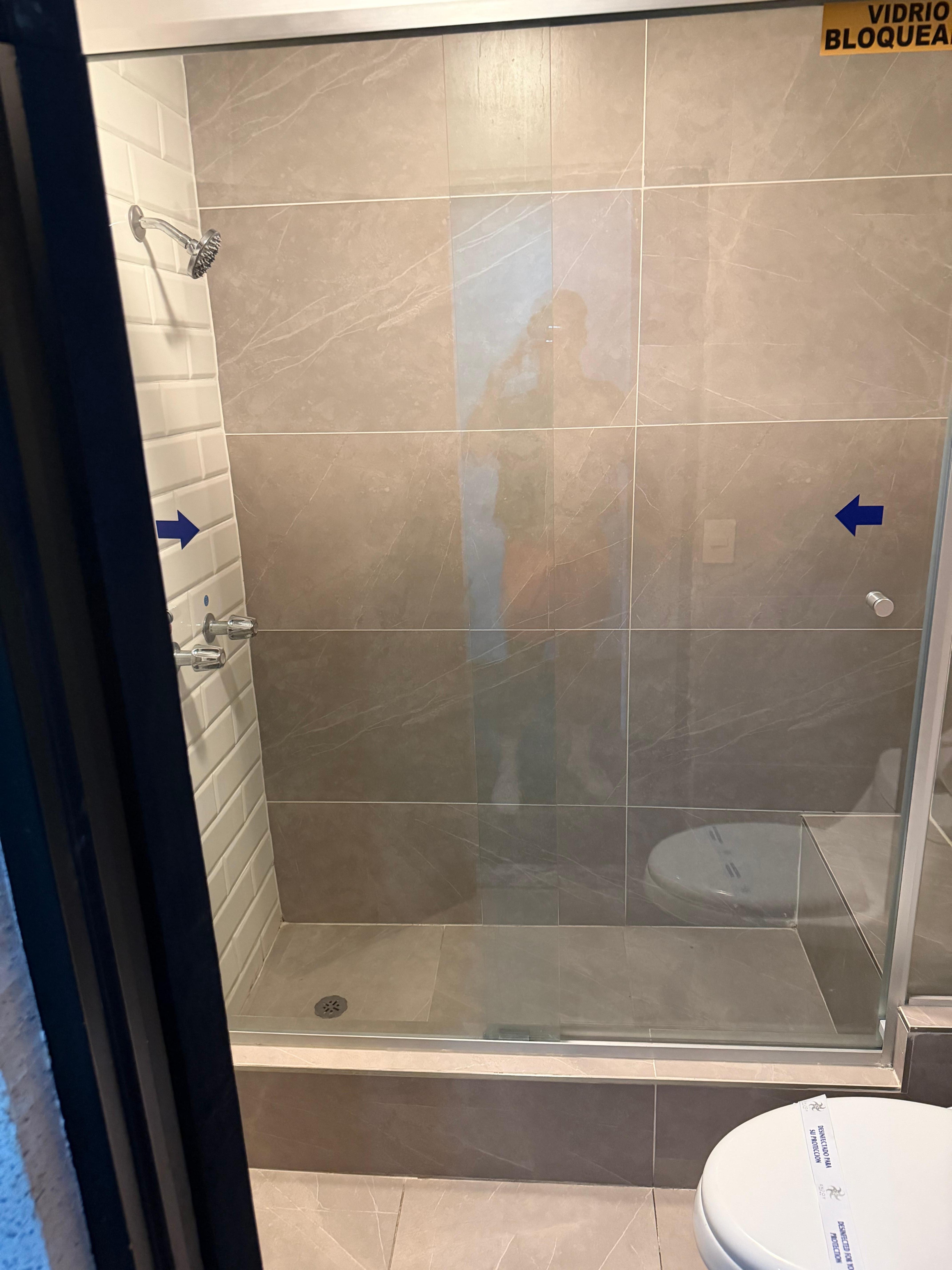 Stand in shower, had a little bench at the back. 