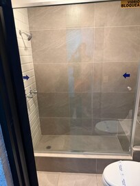 Stand in shower, had a little bench at the back.