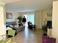 From the front door, queen size sofa bed, 2 reclining chairs, TV