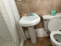 Knees hit wall when on toilet