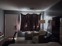 Window dressing not hung properly and rattled with rips and tears