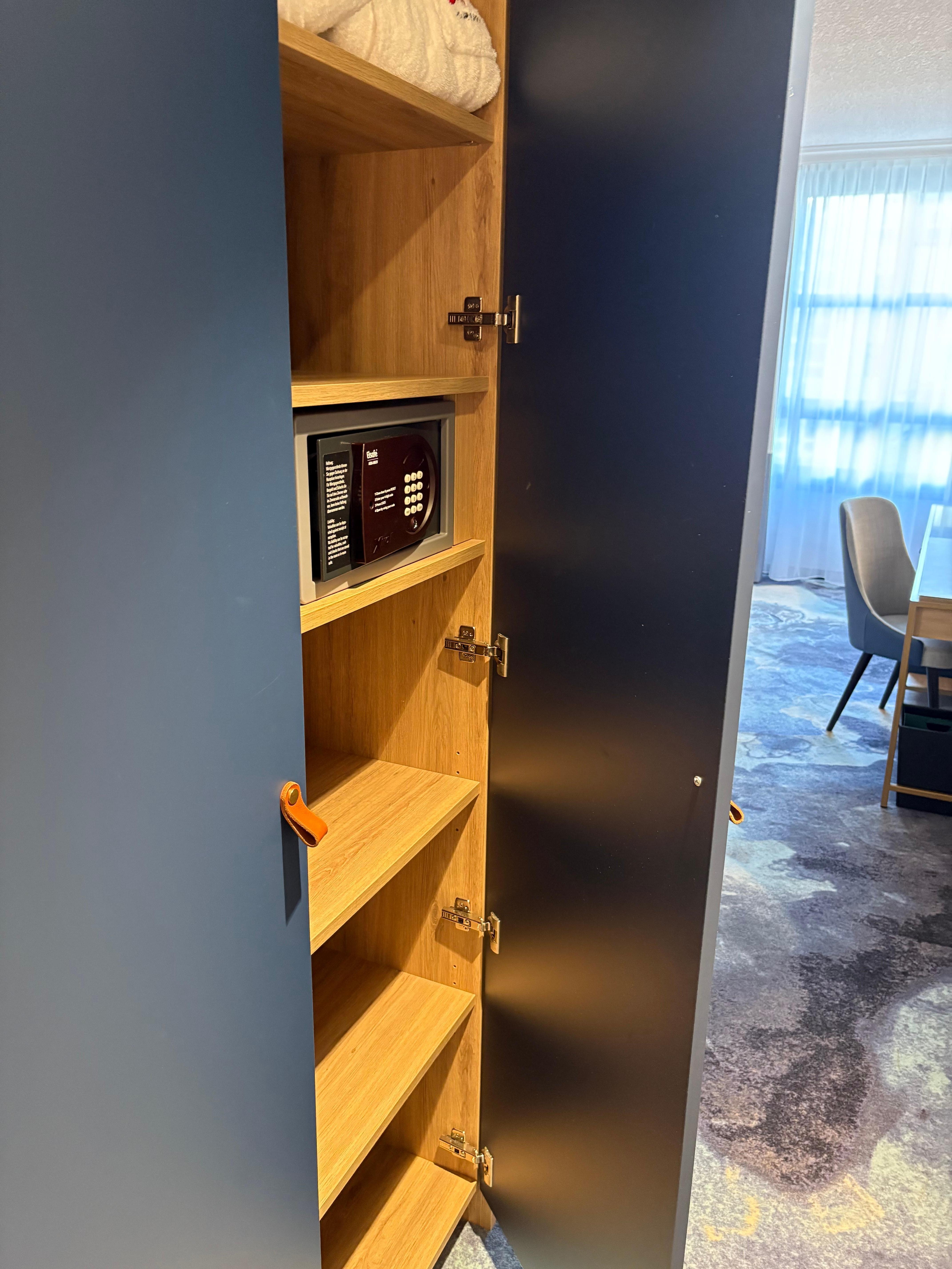 Ironing board, safe and plenty of shelves