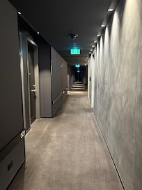 Due to the footprint, corridors initially seemed maze like. The room number height is an interesting design. Allows subtle lighting in hallways.