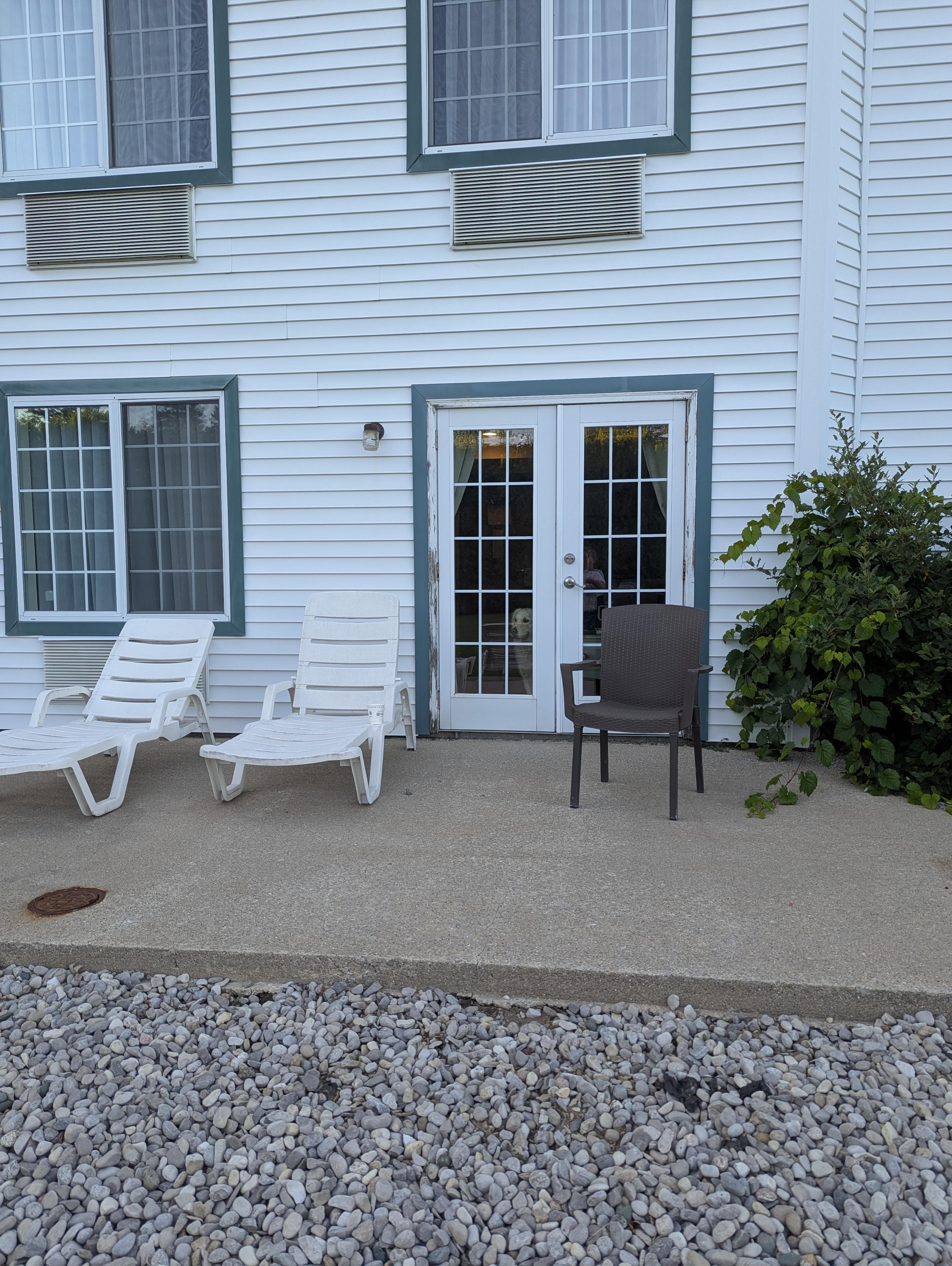 The rocks are only around the edge of the patio/building.