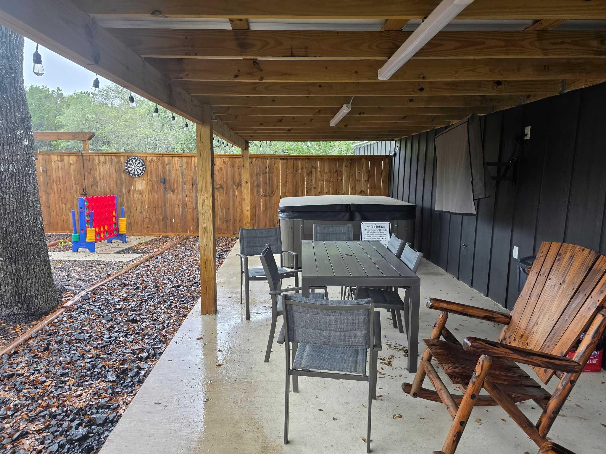 Downstairs Patio Table, Hot Tub, TV, Chairs