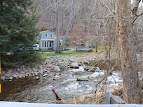 View from across the river, on the road.