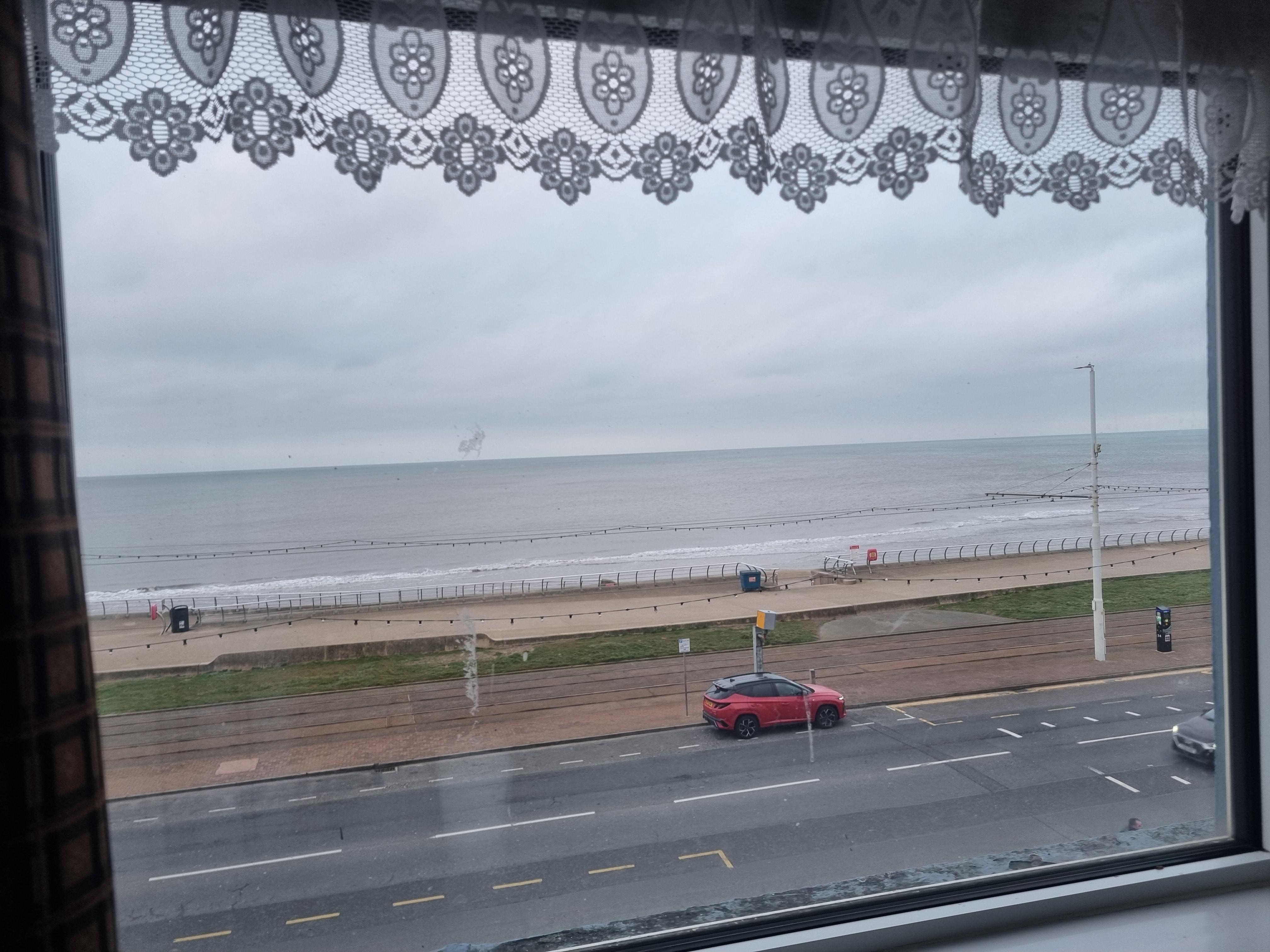 Nice sea view first thing in the morning. The top part of the window opens.