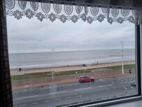 Nice sea view first thing in the morning. The top part of the window opens.