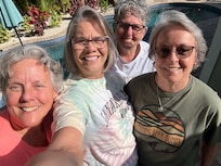 In front of the pool.