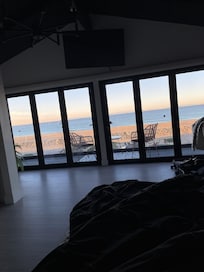 View from king bed with a remote for the blinds to open to this great view!