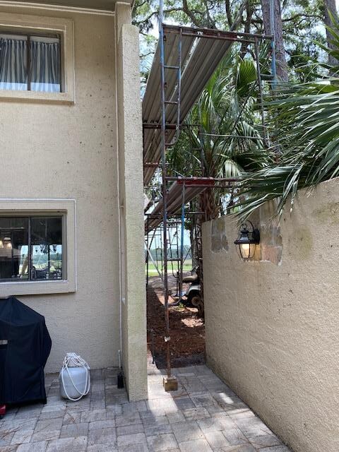 Scaffolding surrounded the entire unit and nearby units