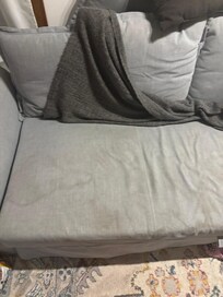 Giant brown mystery stains they had a blanket placed over to hide the stains