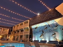 One side of the pool/lounge area at night