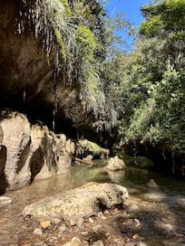 Visiting the charco azule caves and arenales canyon.
