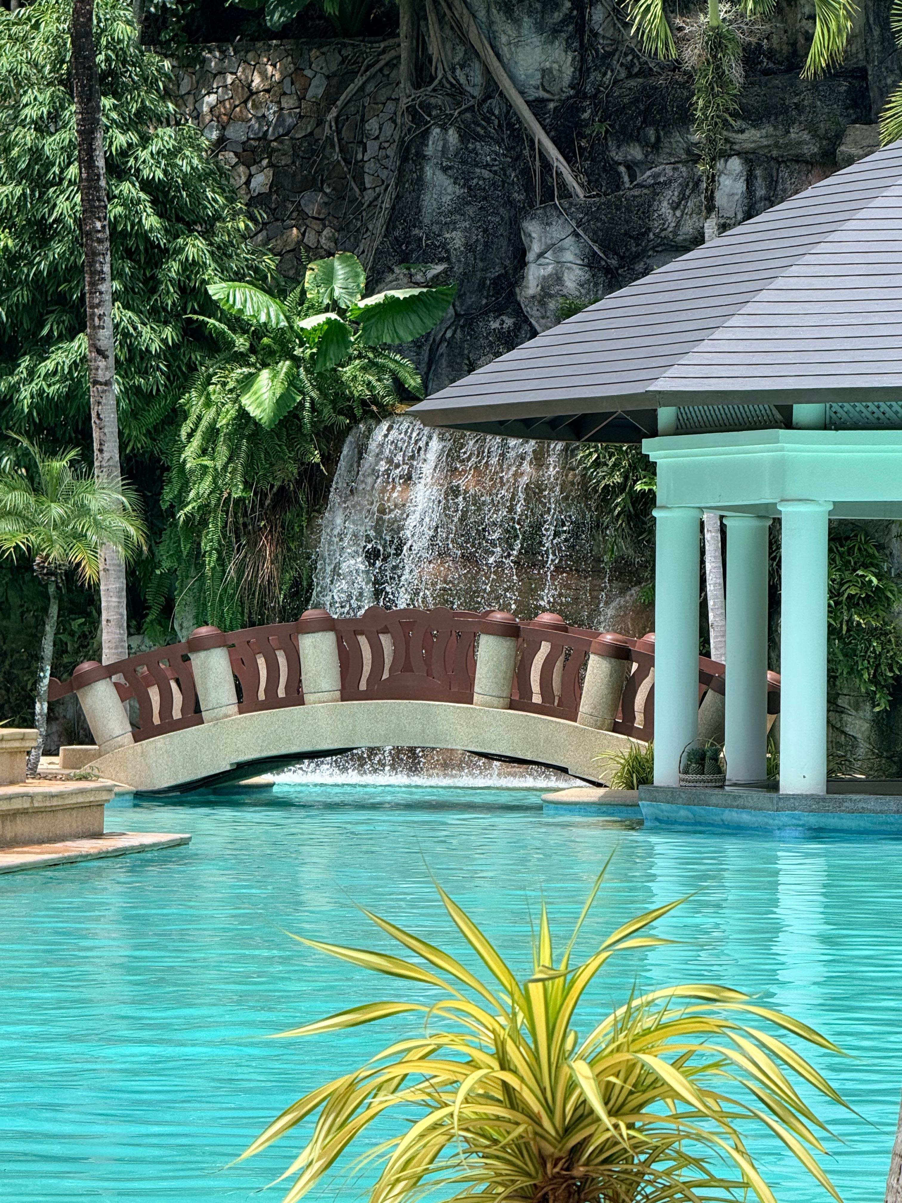 Waterfall pool and swim up bar