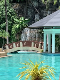 Waterfall pool and swim up bar