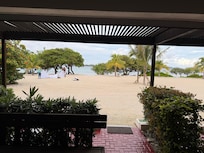 View from the patio of the condo looking at the beach and ocean.