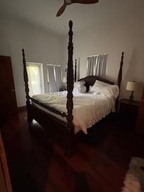 One of the many bedrooms! Love the four poster bed. Plus a nice closet and full bathroom.