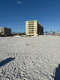 The condo from the beach. Walk out into the sand.
