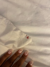 On the back side of the pillow