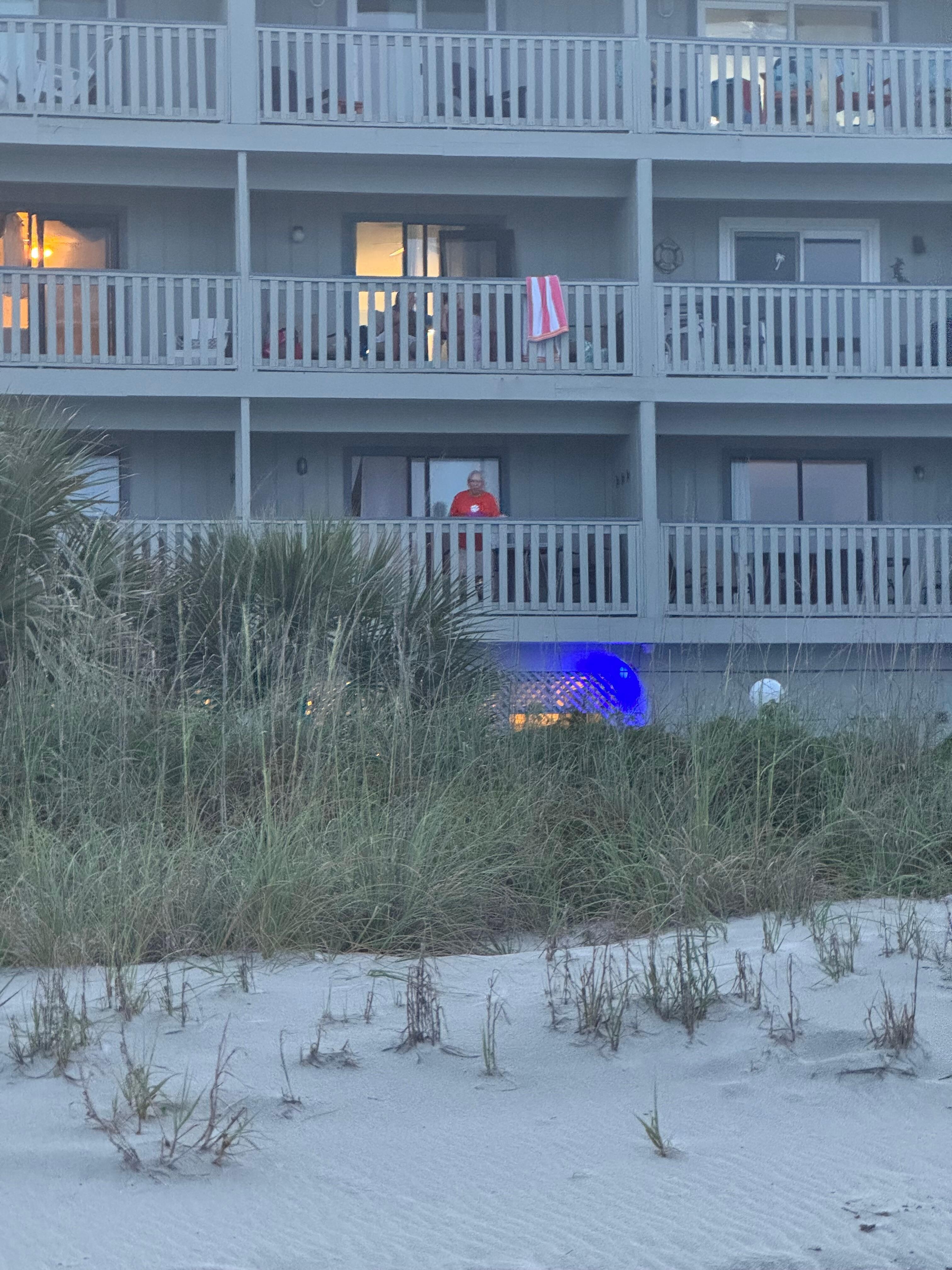 The orange spot in the middle of first floor balcony is my husband.