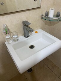 Bathroom sink with broken faucet