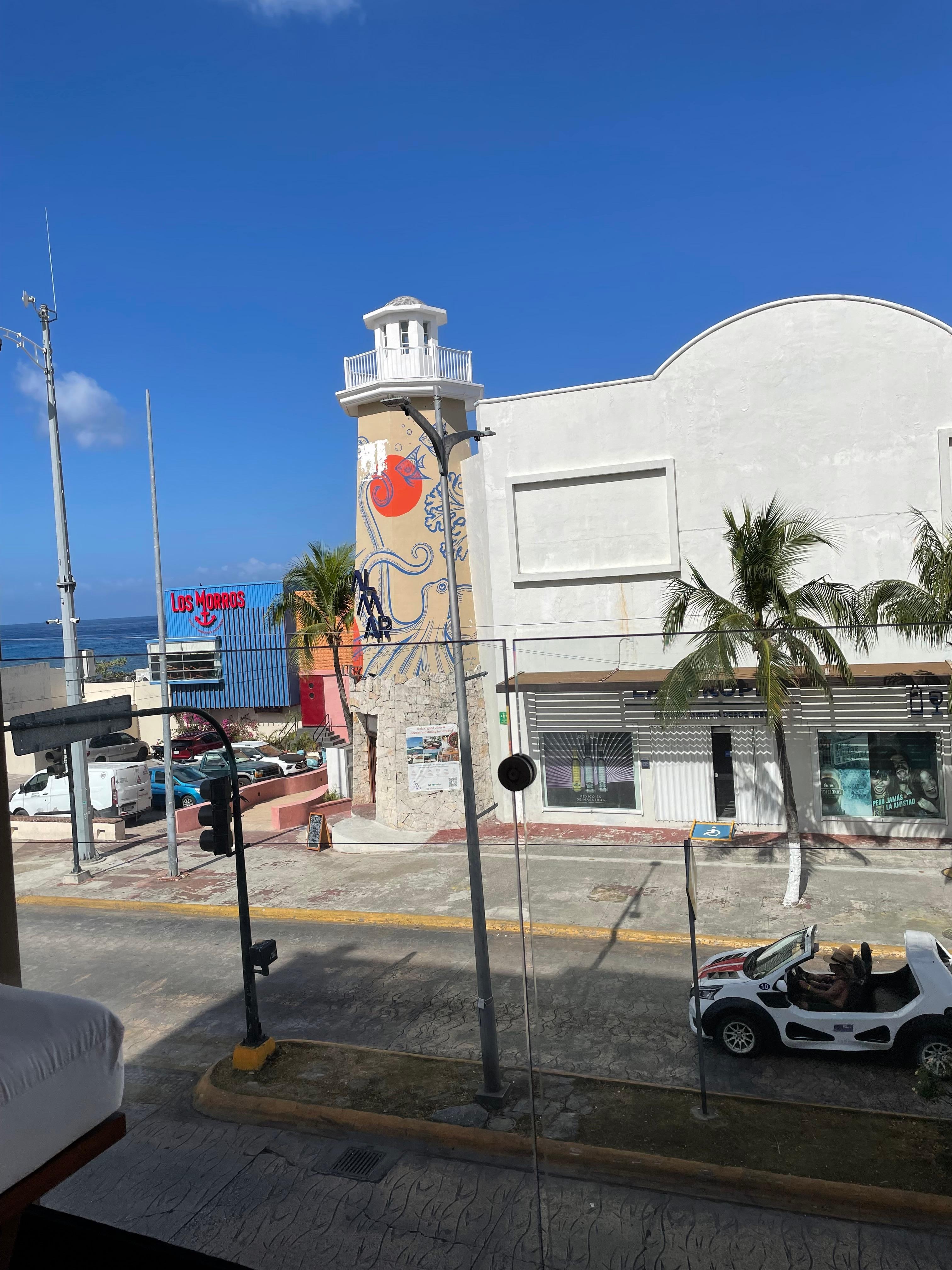 Location downfall, stoplight. Lots of vehicle, stereo and people noise.