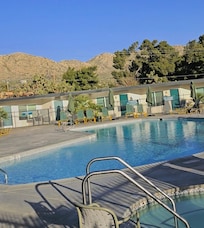 Pool and jacuzzi with mountains all around