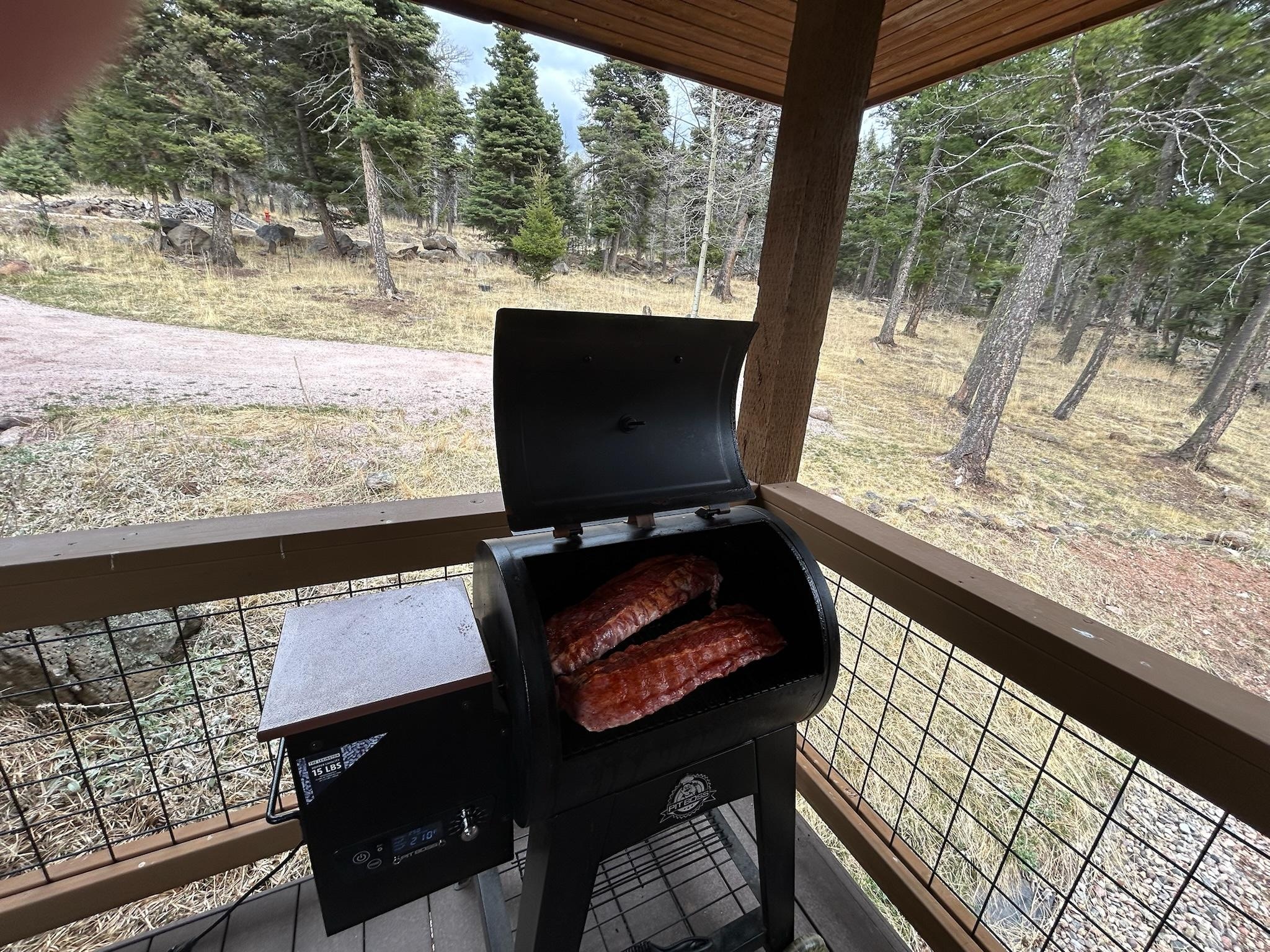 Smoking meat on the pellet smoker - there’s also a propane grill