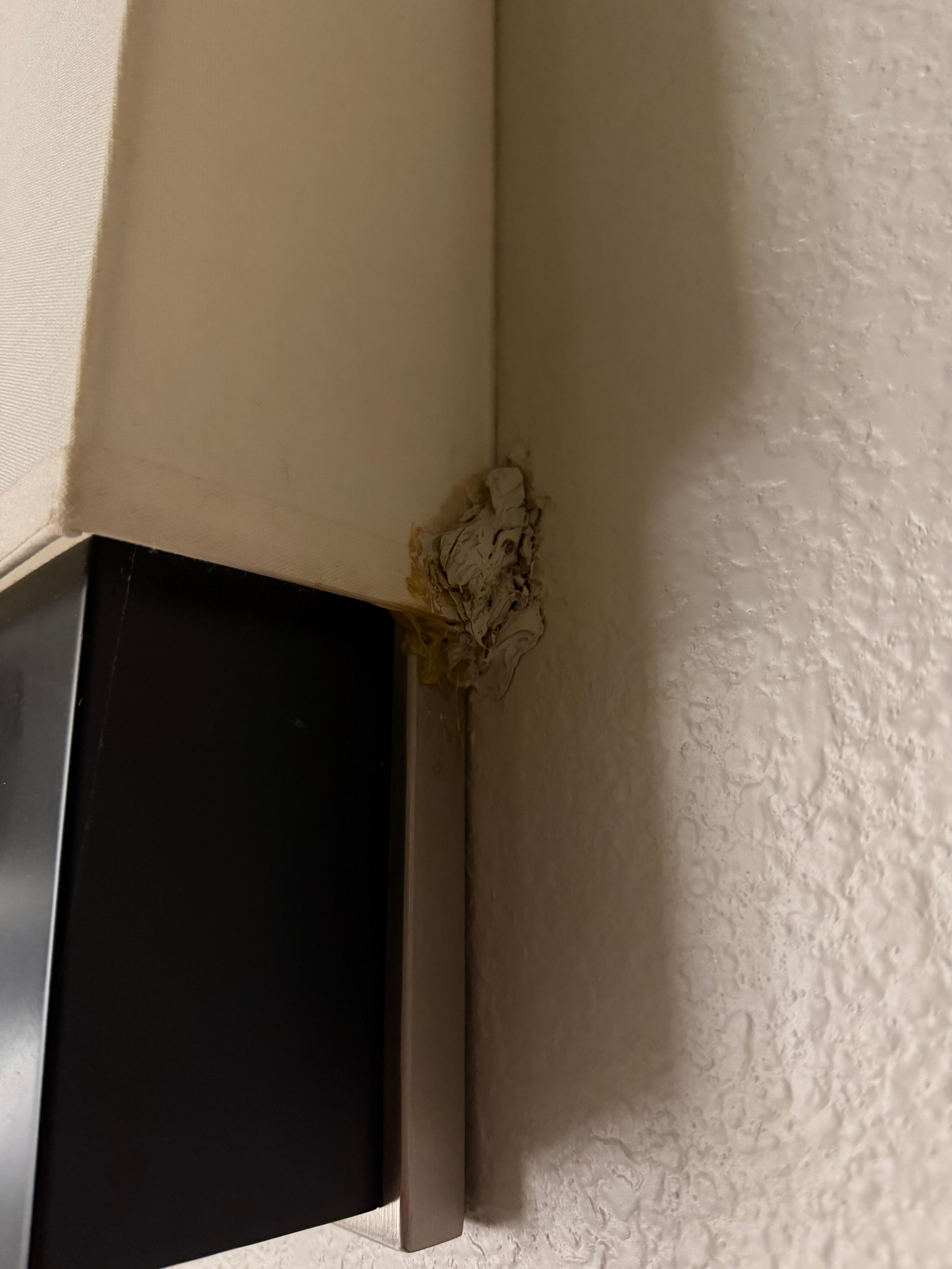 Lamp looked like it had been ripped off the wall