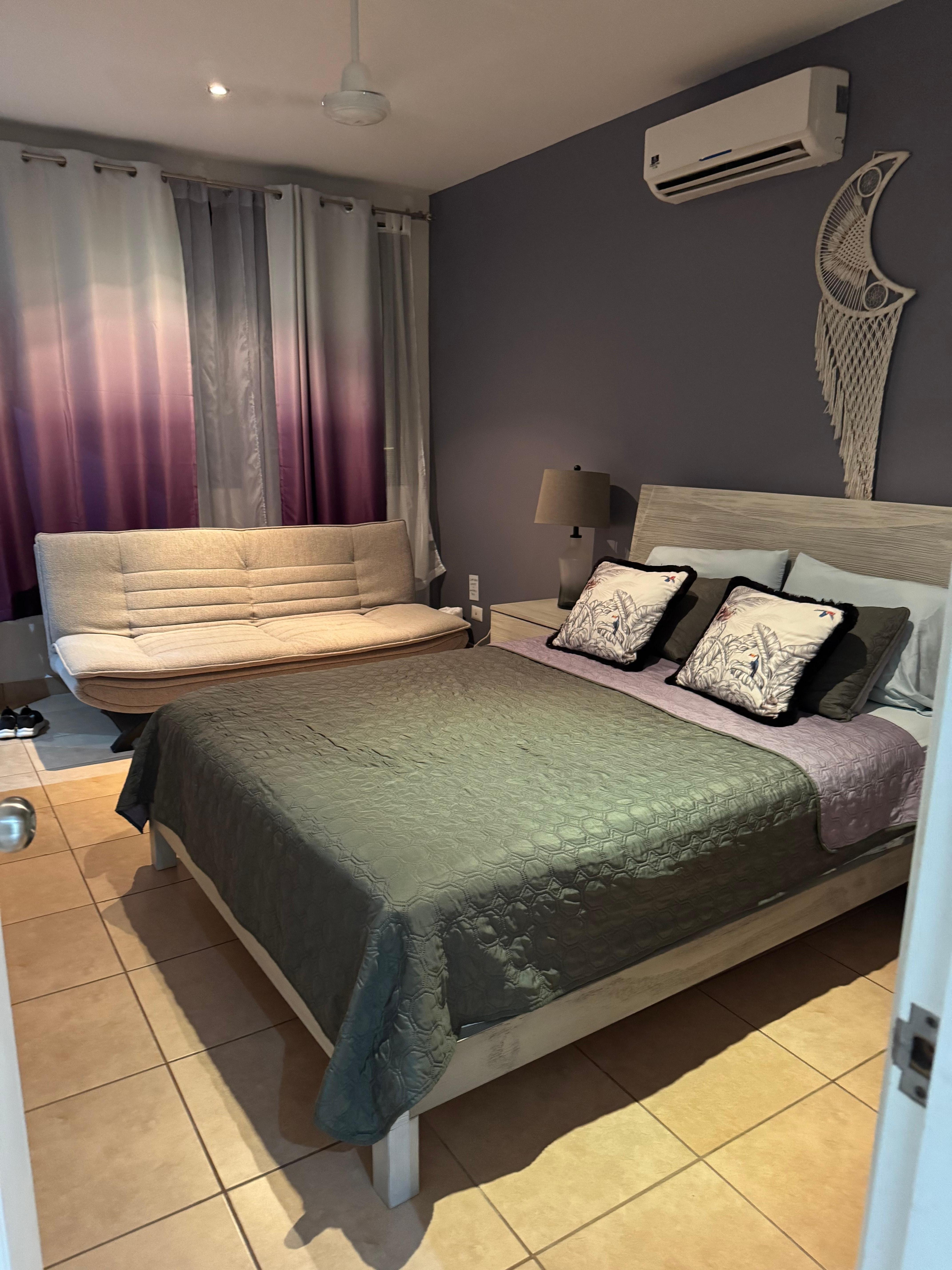 Master bedroom with futon and ensuite for extra privacy. 