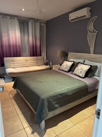 Master bedroom with futon and ensuite for extra privacy.